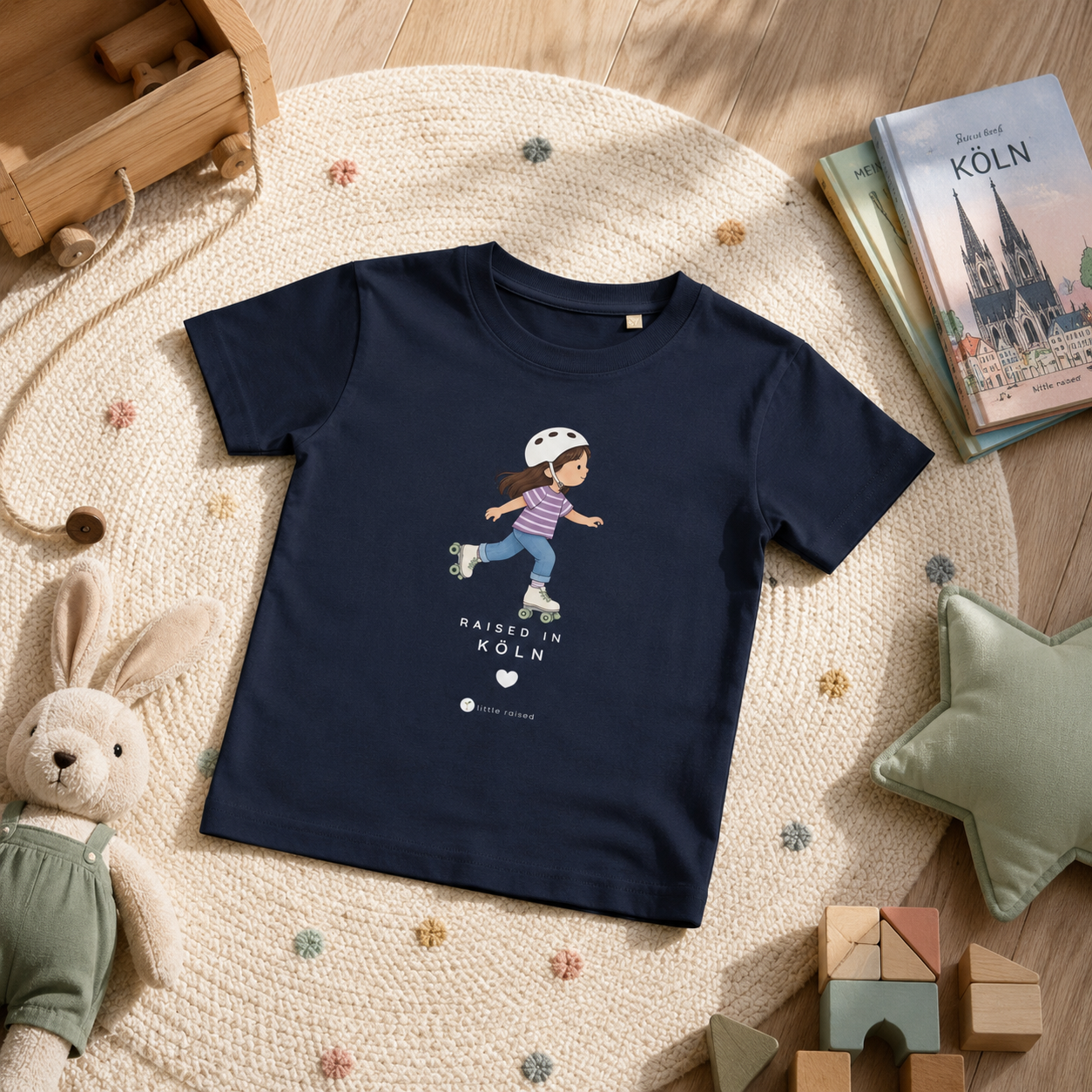 Kinder T-Shirt aus Bio-Baumwolle: Raised in Köln
